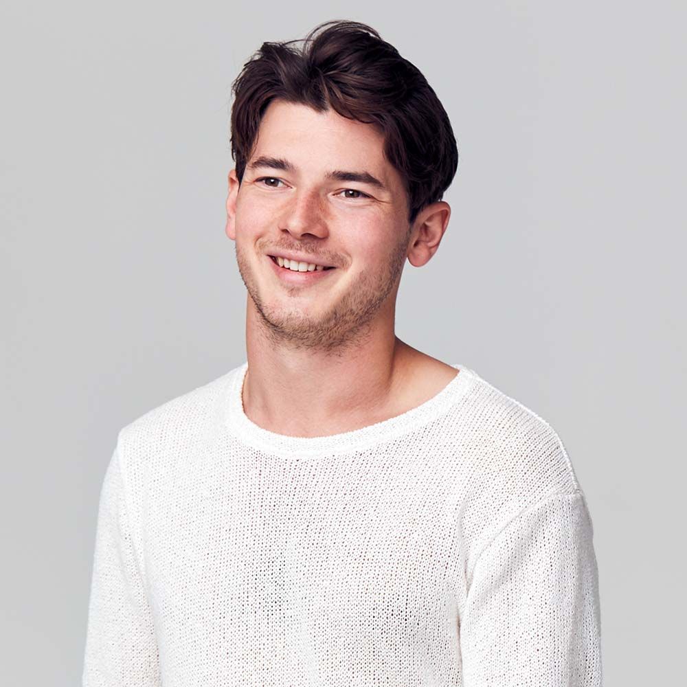 studio portrait of young man wearing white t shirt 3uuy3yq.jpg